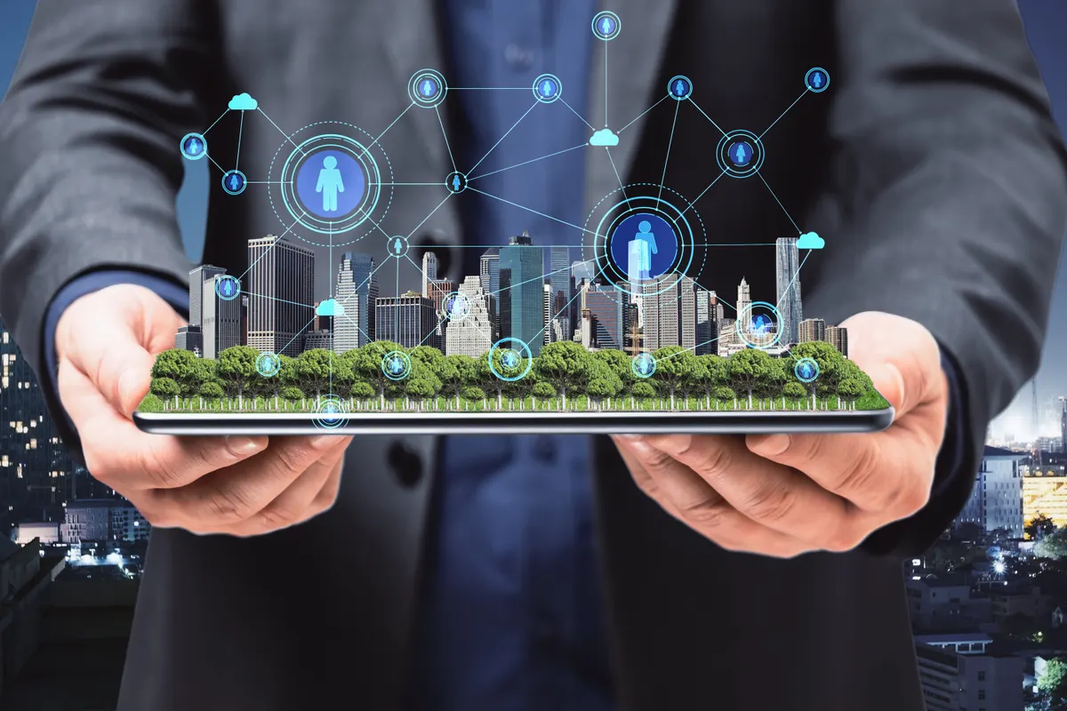 A connected city network rising from a tablet