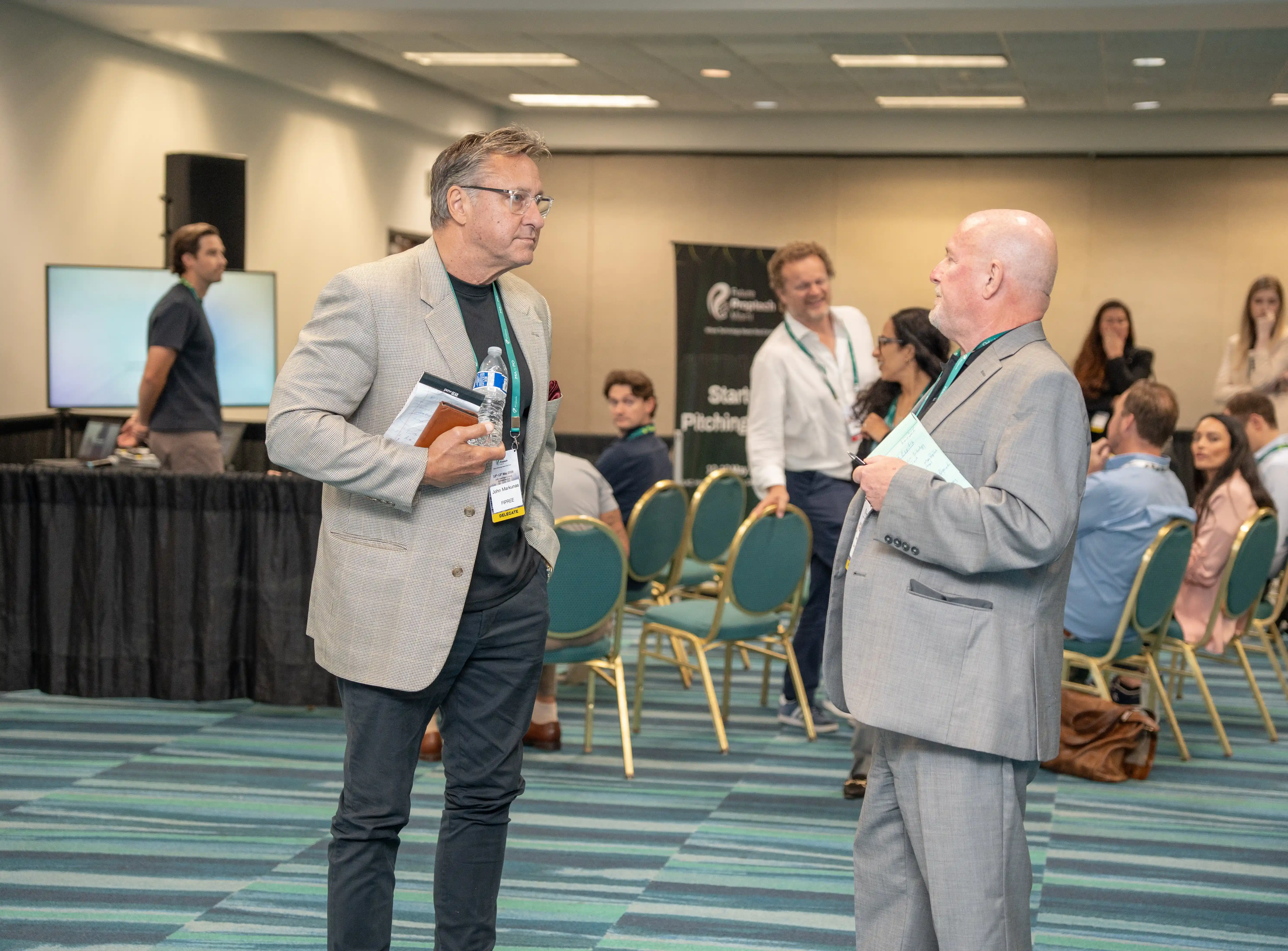 Delegates gathered at an exhibitor stand at Future PropTech