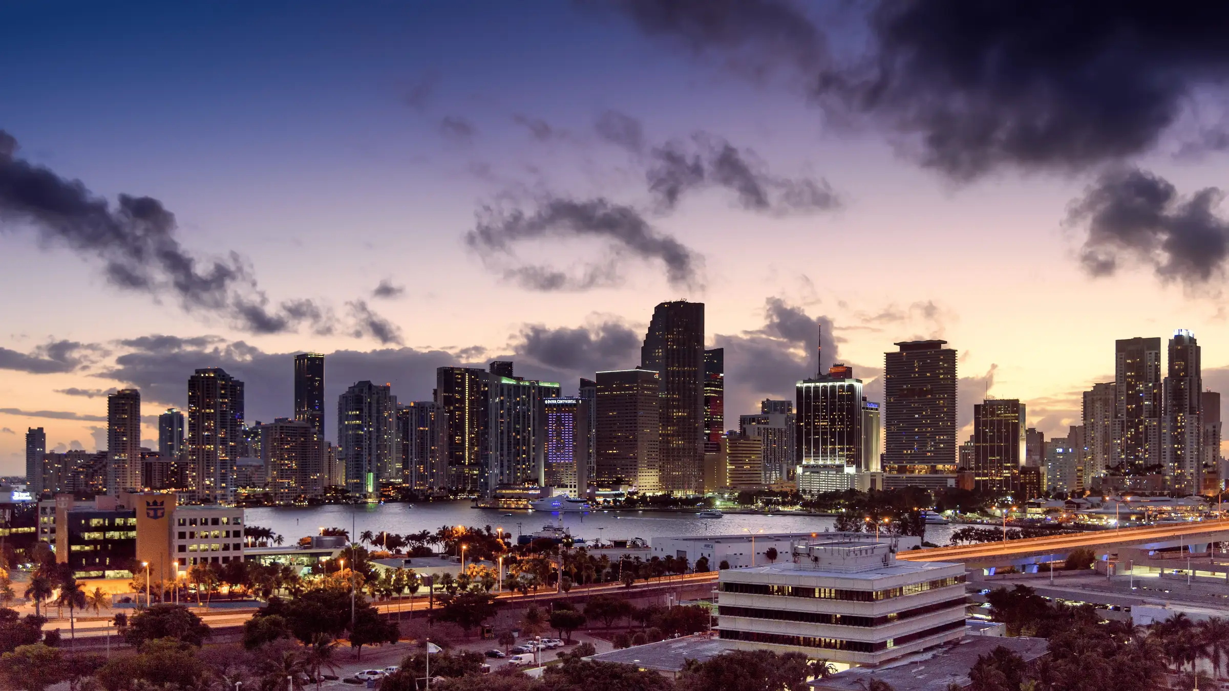 Downtown Miami skyline across Biscayne Bay at dusk